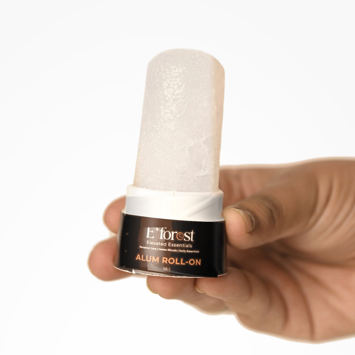 Alum crystal roll-on held in hand